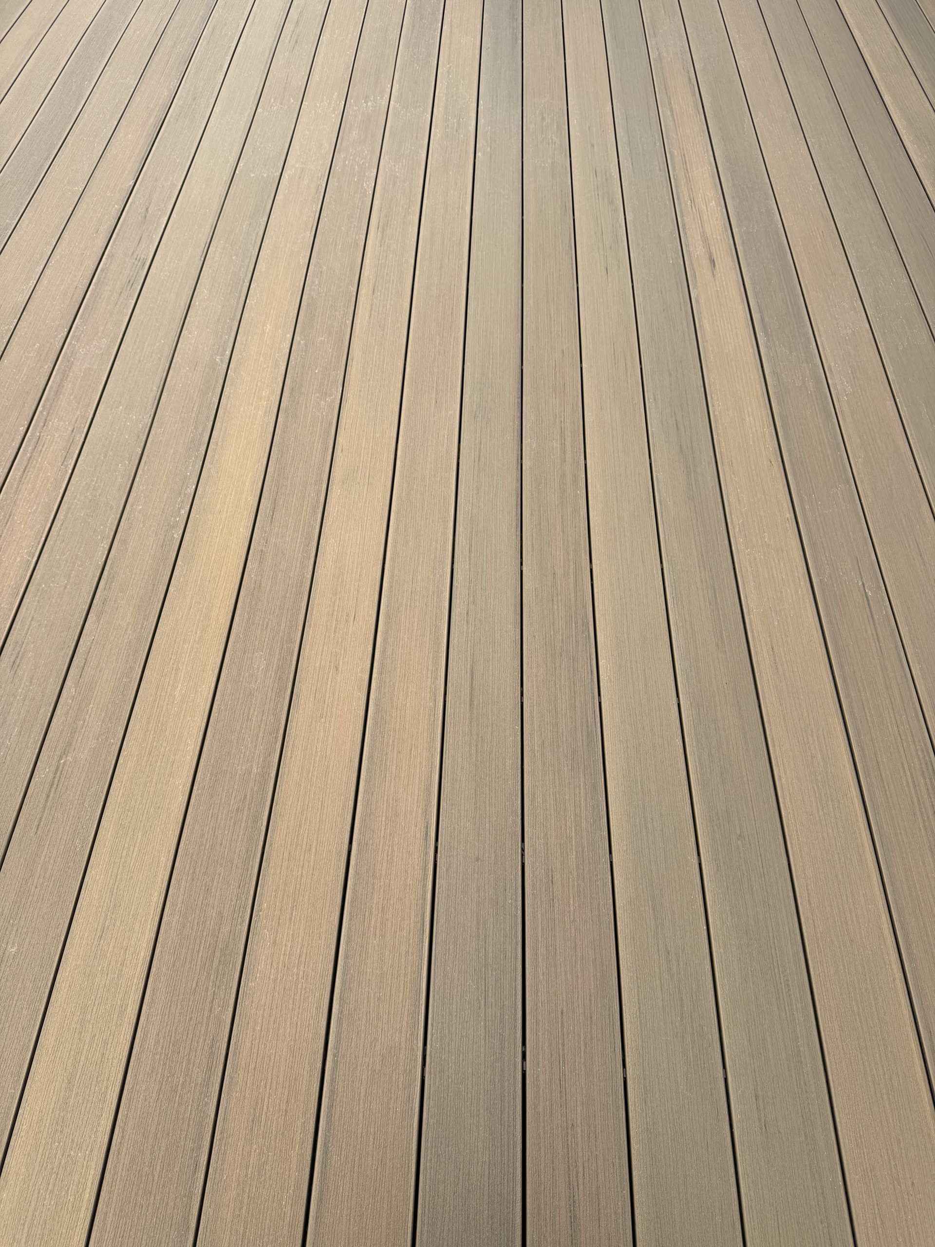 Close-up of new composite decking boards installed by Cohen Construction