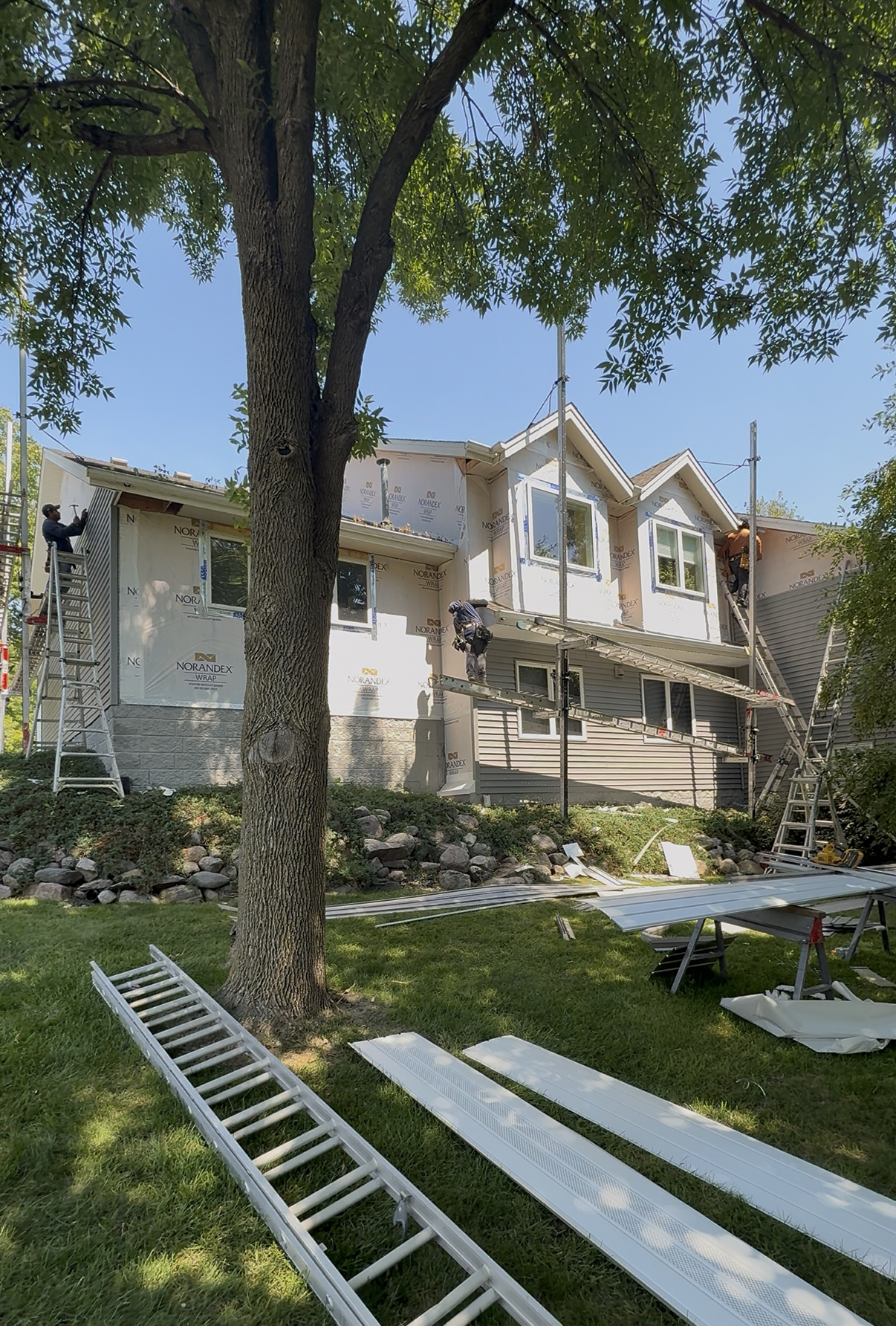 Minnetonka, MN home wrapped and scaffolded during a siding replacement